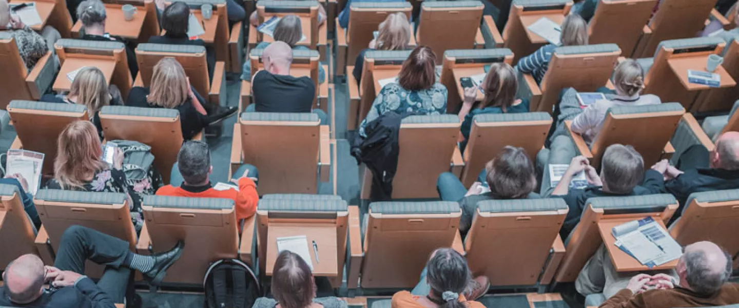 conference-in-auditorium.jpg