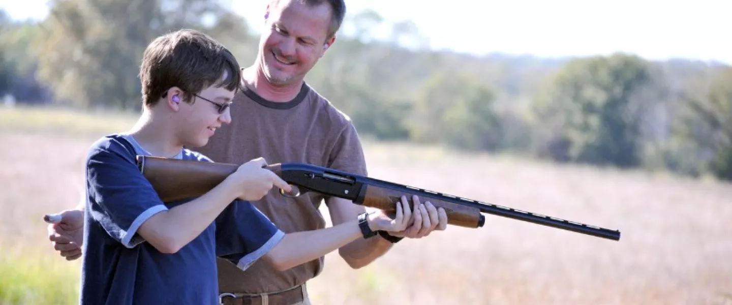 father-instructing-son-on-proper-gun-safety.jpg