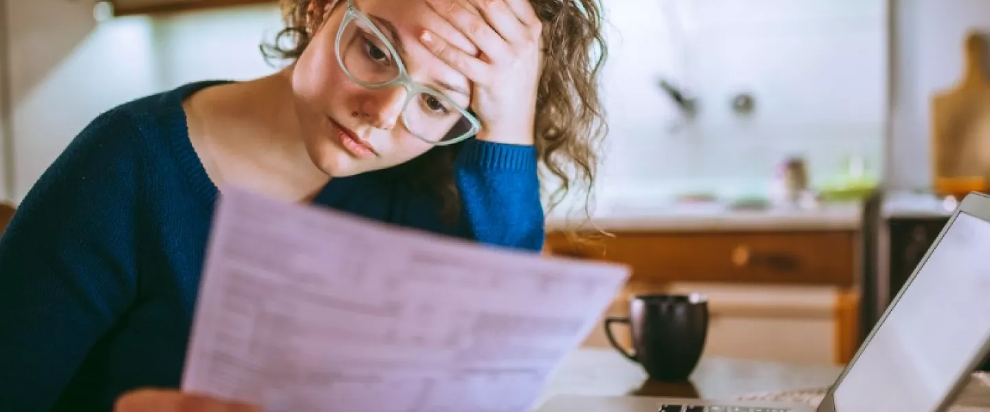 woman-going-through-bills-looking-worried.jpg